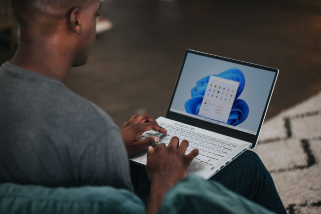 How-to-Create-Insightful-Dashboards-in-Microsoft-Power-BI-Featured-Image-scaled.jpg man in gray long sleeve shirt using Windows 11 computer